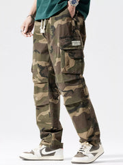 Casual cargo pants in camouflage pattern with drawstring waist and multiple pockets.