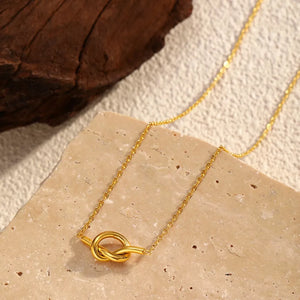 Gold-plated knot pendant necklace with delicate chain