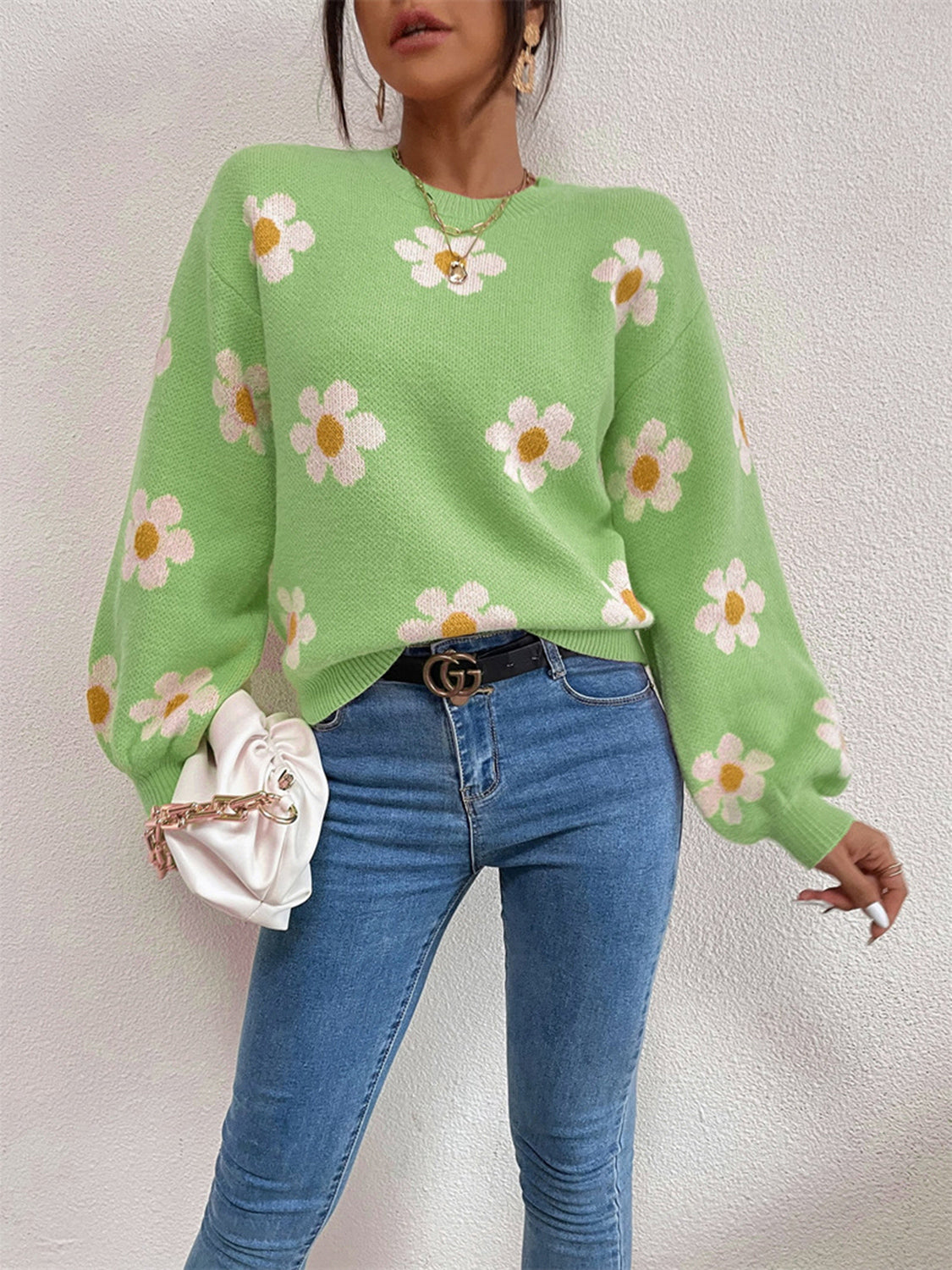Mid Green knit sweater with puff sleeves and a white daisy floral print.