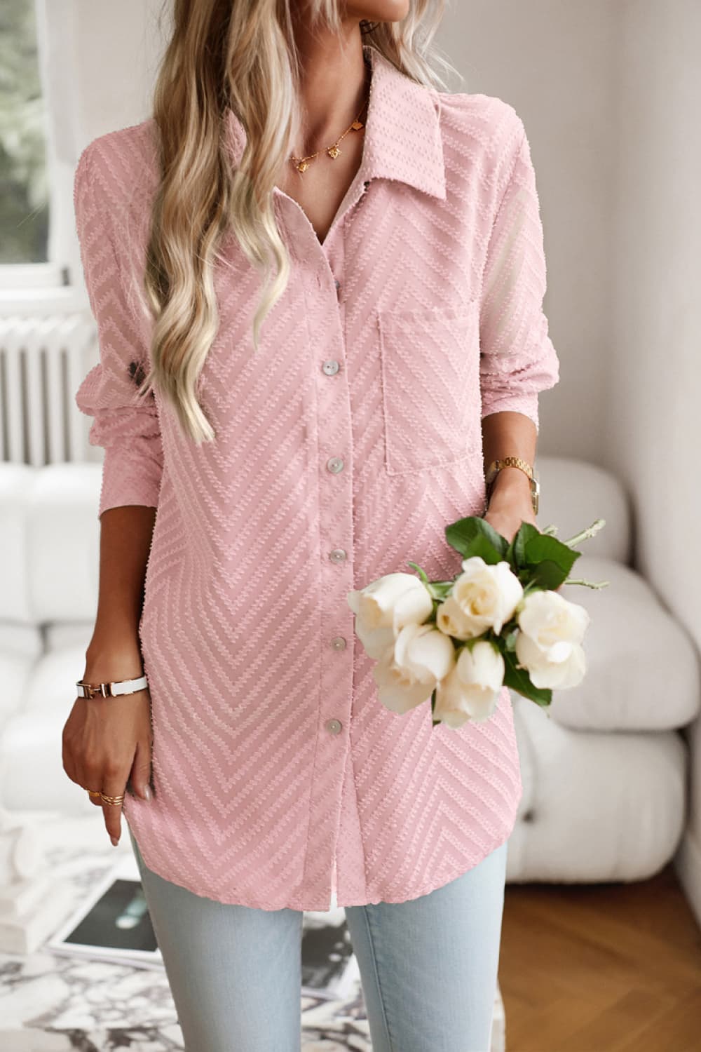 Blush pink textured chevron button-down blouse with a pocket and collared neckline.