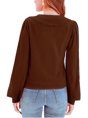 Chocolate knit cardigan with scalloped collar and balloon sleeves.