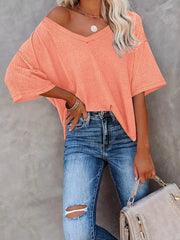 Coral pink waffle knit relaxed v-neck t-shirt with short sleeves.