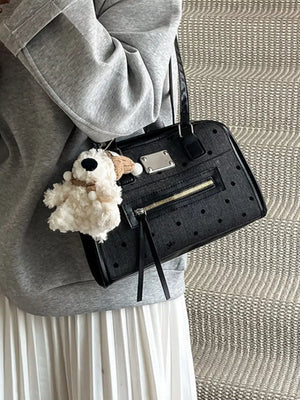 Black polka dot shoulder bag with zipper pocket and dog charm