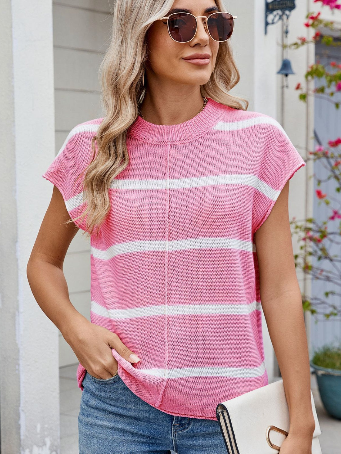 Pink and white striped knit tee with cap sleeves and vertical seam detail.