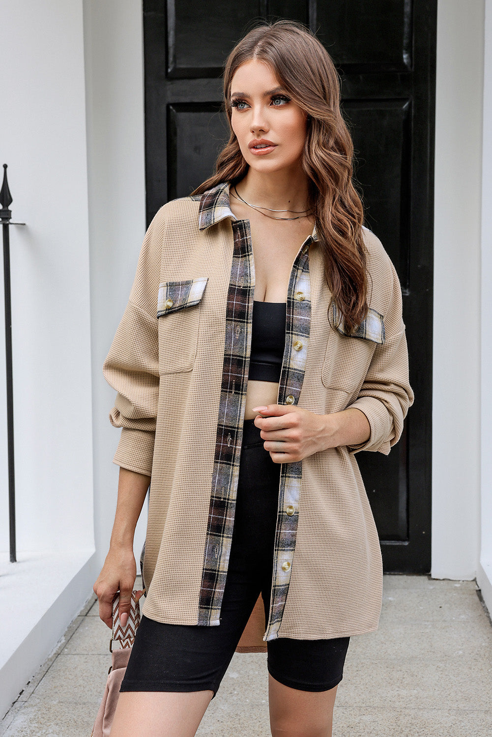 Tan waffle knit overshirt with plaid trim and button details.