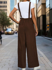 Brown corduroy wide-leg suspender jumpsuit with elastic waist and buttoned front.