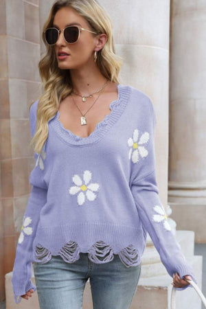 Purple distressed knit sweater with daisy appliques and frayed hem.