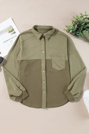 Moss waffle knit shacket with gathered sleeves, collar, and chest pocket.