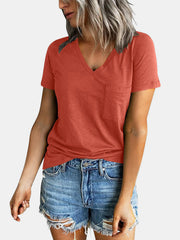 Raglan pocket t-shirt in a coral hue with a V-neck and short sleeves.