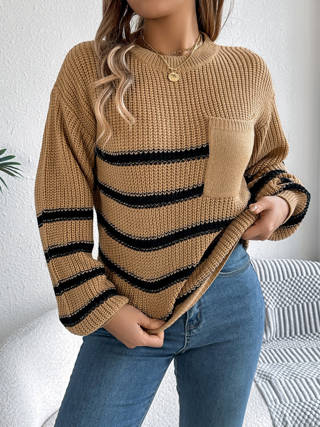 Caramel striped knit sweater with chest pocket and crew neck.