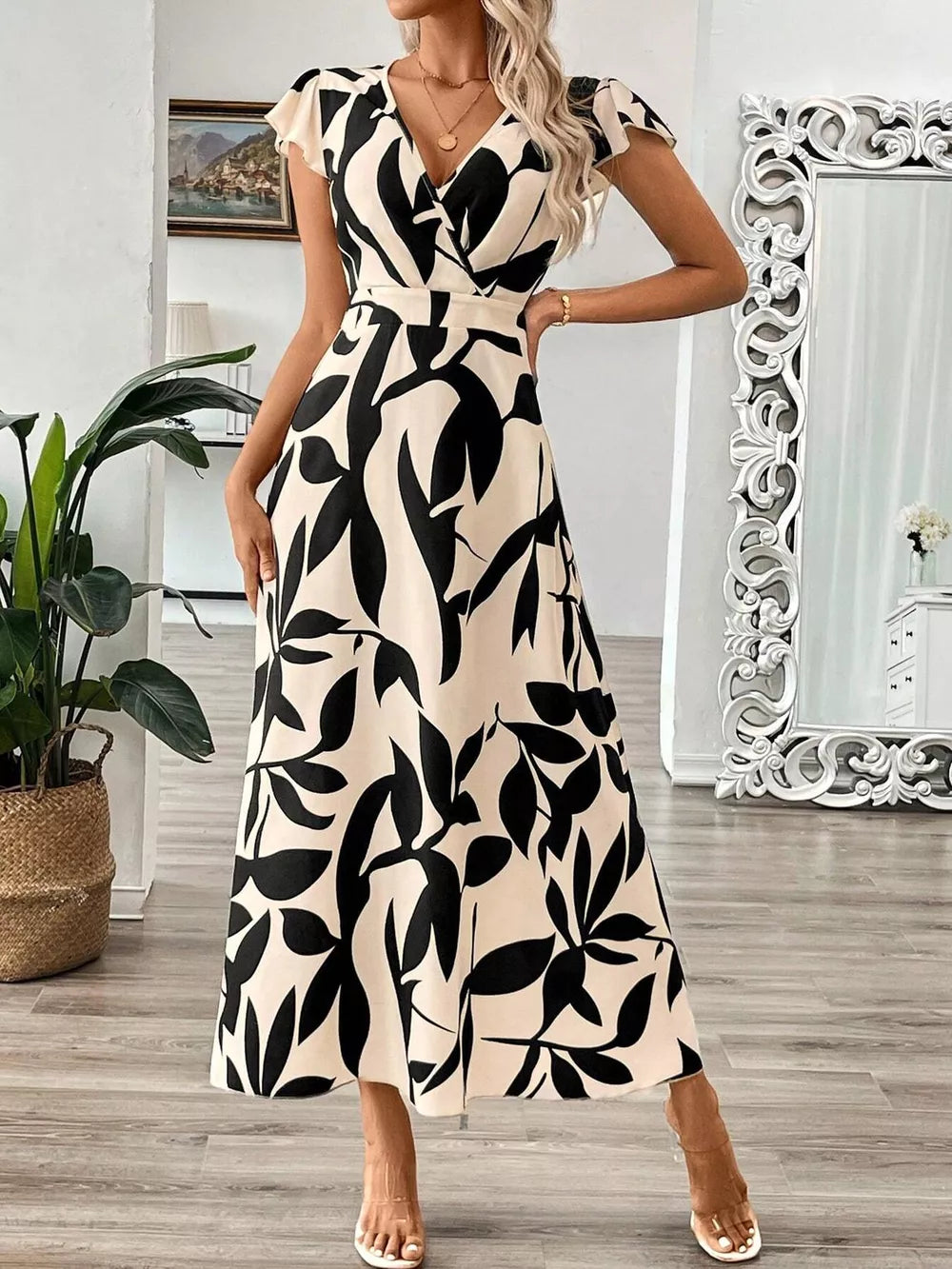 Floral print midi dress with cap sleeves and a V-neck in black and apricot.