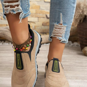Khaki suede-like round toe slip-on sneakers with "OUTDOOR" detail and colorful beaded anklet.