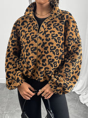 Caramel leopard print sherpa bomber jacket with zip front and high collar.