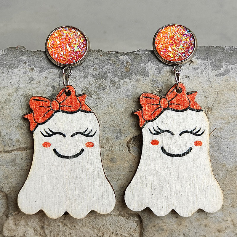 Spooky ghost dangle earrings with orange bows and glitter studs.