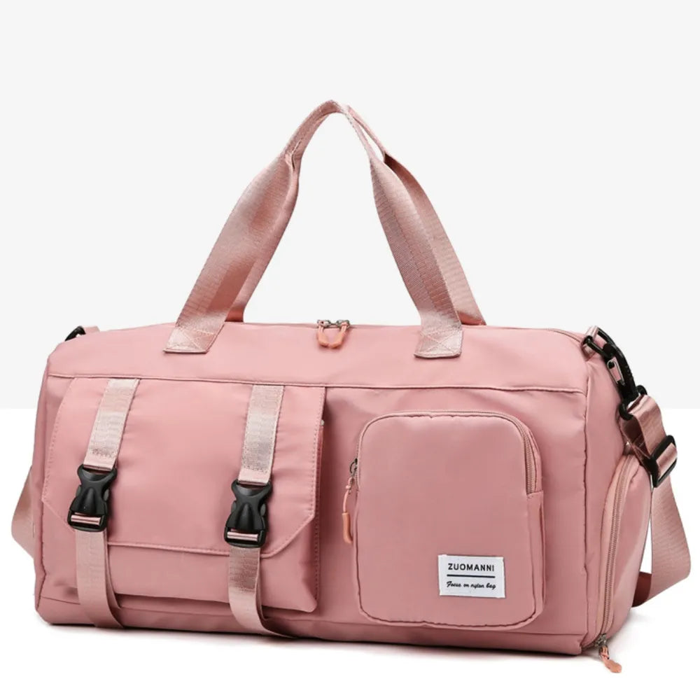 Dusty Pink gym duffel bag with buckle details and multiple pockets.