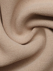 Smocked waist wide leg pants in beige cotton with a textured weave.