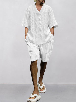 White cable-knit v-neck two-piece set with shorts and short sleeves.