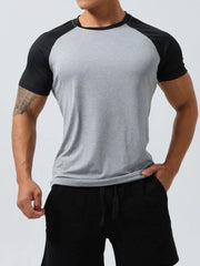 Raglan sleeve performance tee in light gray with black sleeves and neckline.