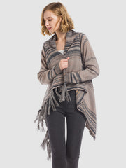 Asymmetric fringe stripe cardigan in tan with dark gray stripes and fringe detail.