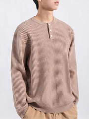 Men's ribbed knit top in apricot with button detail and crew neck.