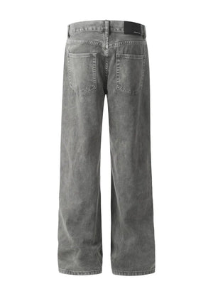 Acid wash wide-leg denim trousers in gray, showing back pockets and relaxed fit.