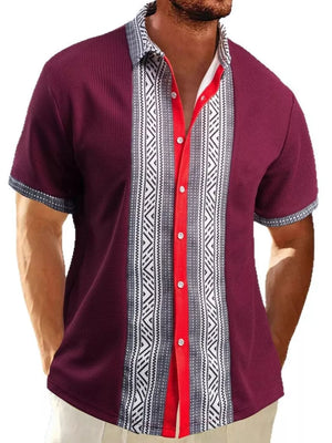 Men's short sleeve wine red shirt with bold geometric print panel and red button placket.