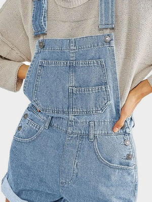 Light wash denim short overalls with rolled hem and button details.