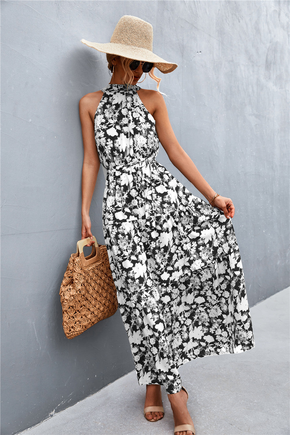 Black/White/Floral maxi dress with halter neckline and tiered skirt.