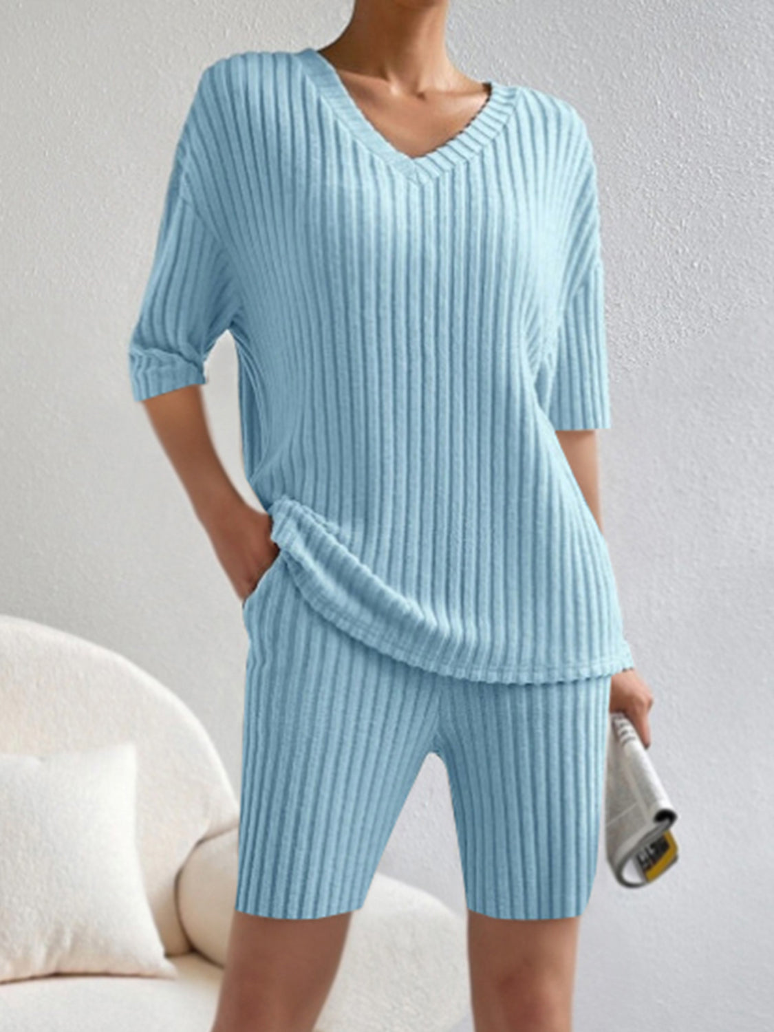 Light blue ribbed V-neck loungewear set with short sleeves and shorts.