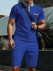 Blue polo shirt and shorts set with grey collar and pocket detail