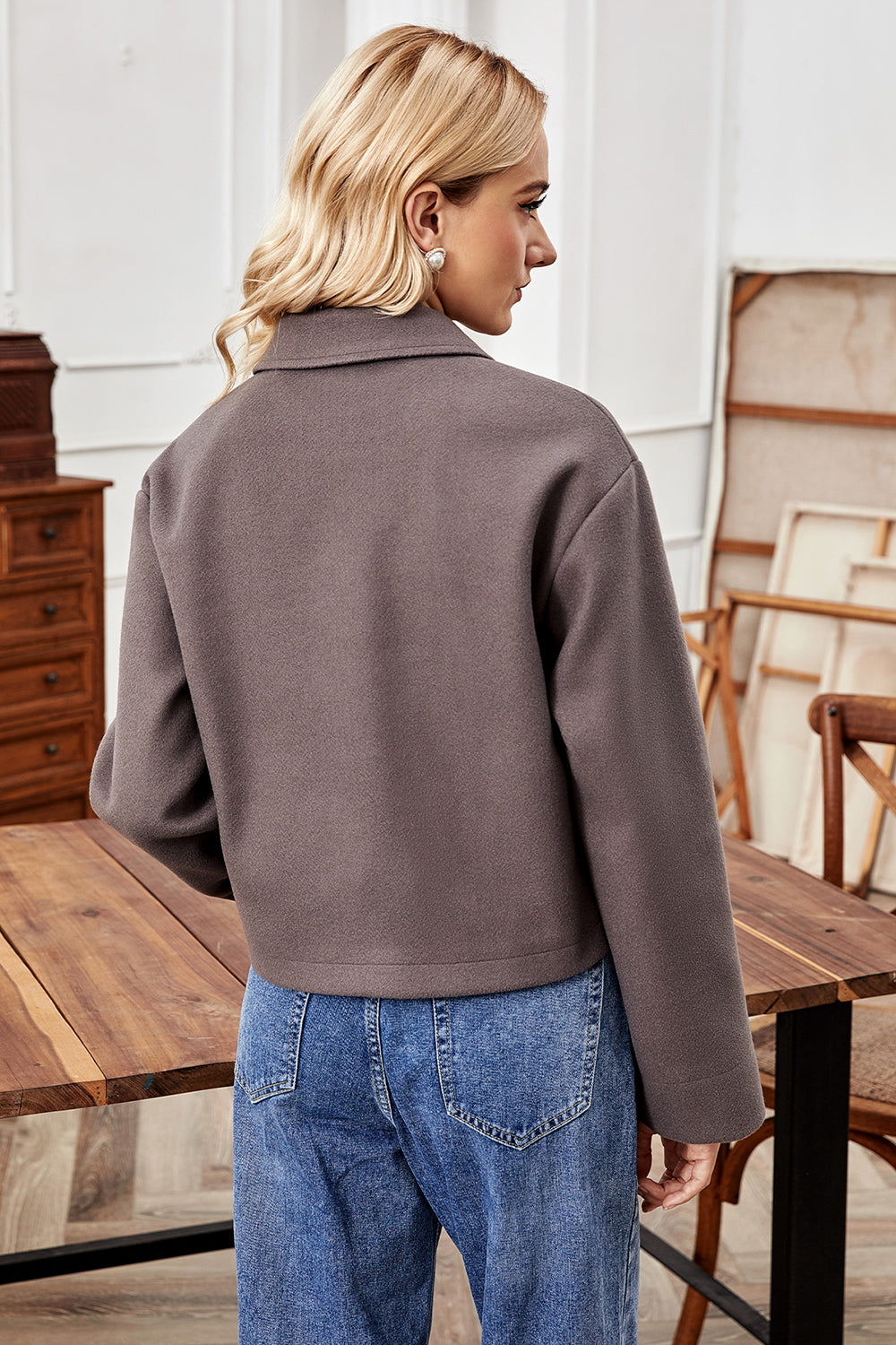 Mocha cropped wool-blend collarless jacket with buttoned front and lapel collar.