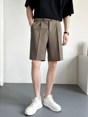 Belted pleated chino shorts in mocha color with a relaxed fit.