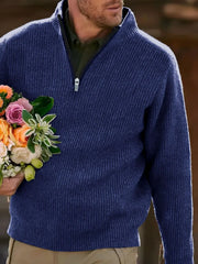 Textured ribbed quarter-zip sweater in navy with a dark green shirt underneath.