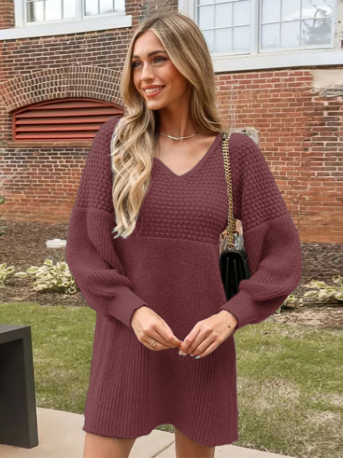 Burgundy balloon sleeve knit mini dress with textured yoke and V-neck.