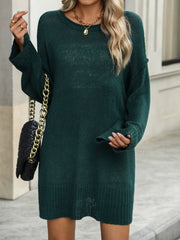 Oversized ribbed knit tunic sweater in Black Forest green with a crew neck and long sleeves.