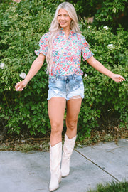 Floral ruffle collar puff sleeve blouse with a vibrant floral print and short sleeves.