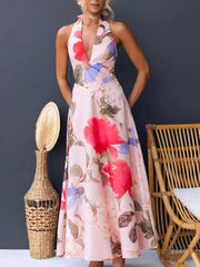 Pink floral halter neck maxi dress with a deep V-neck and a-line skirt.