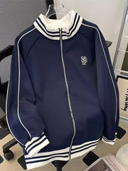 Navy blue zip-up sweatshirt with white piping and striped collar and cuffs.