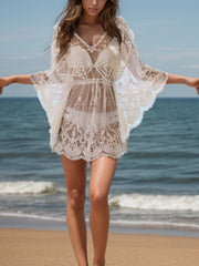 White lace kimono beach cover-up with V-neck, drawstring waist, and bell sleeves.