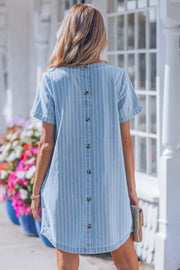 Denim mini dress with vertical white stripes and button back detail.