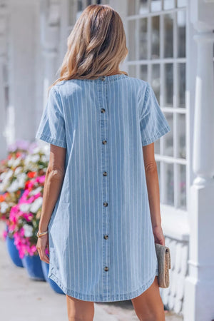 Denim mini dress with vertical white stripes and button back detail.