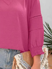 Elegant long sleeve blouse in Rose Purple polyester with smocked cuffs and eyelet detail.