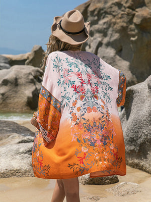 Ombre floral kimono cover-up in orange, 100% viscose, with wide sleeves and a boho print.