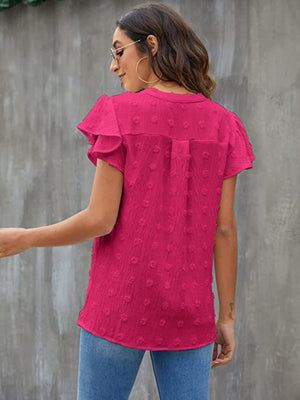 Hot Pink Swiss Dot Flutter Sleeve Blouse with ruffled sleeves and button detail.