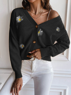 Black button-down cardigan with embroidered daisies, V-neck, and ribbed cuffs.