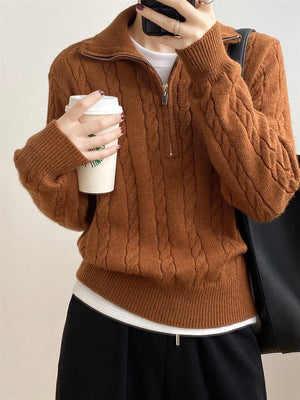 Caramel cable knit quarter-zip pullover sweater with a collared neckline.