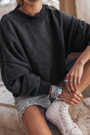 Acid wash mock neck sweatshirt in black with ribbed cuffs and neckline.