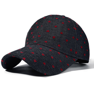 Black baseball cap with all-over red heart pattern