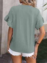 Sage green textured blouse with flutter sleeves and vertical ribbing.
