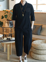 Black men's 3/4 sleeve casual pants set with embroidered detail on shirt.